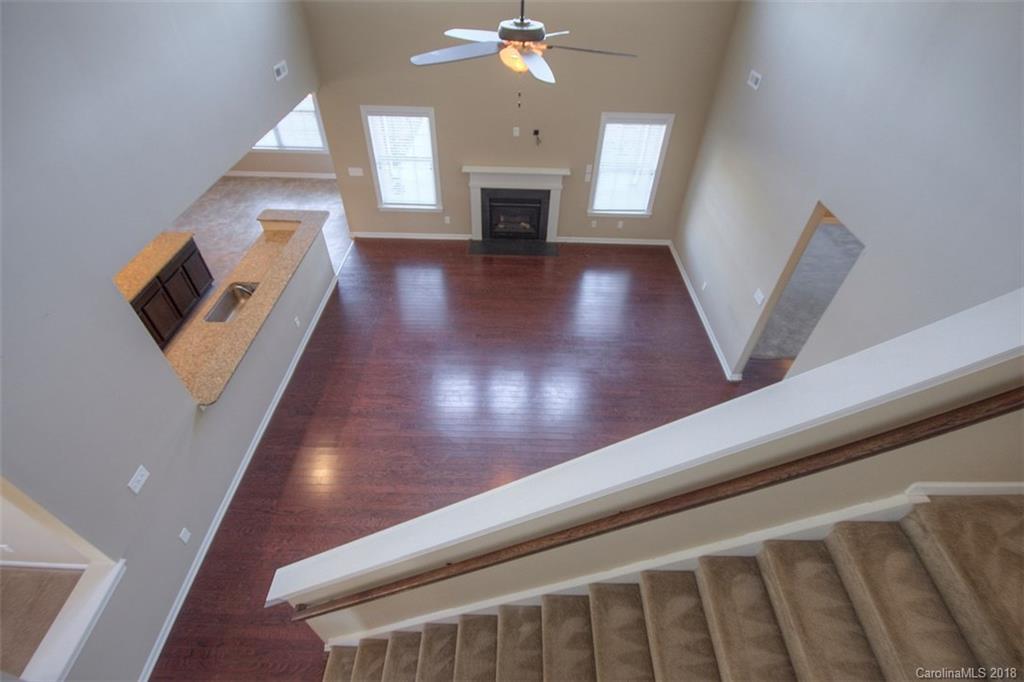2001 Spring Rose Lane Wesley Chapel, NC 28104 - Photo 31 of 36 a view of a livingroom with wooden floor and fireplace