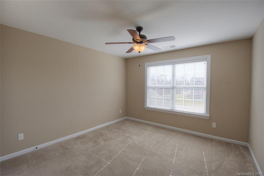 2001 Spring Rose Lane Wesley Chapel, NC 28104 - Photo 33 of 36 an empty room with a window and a fan