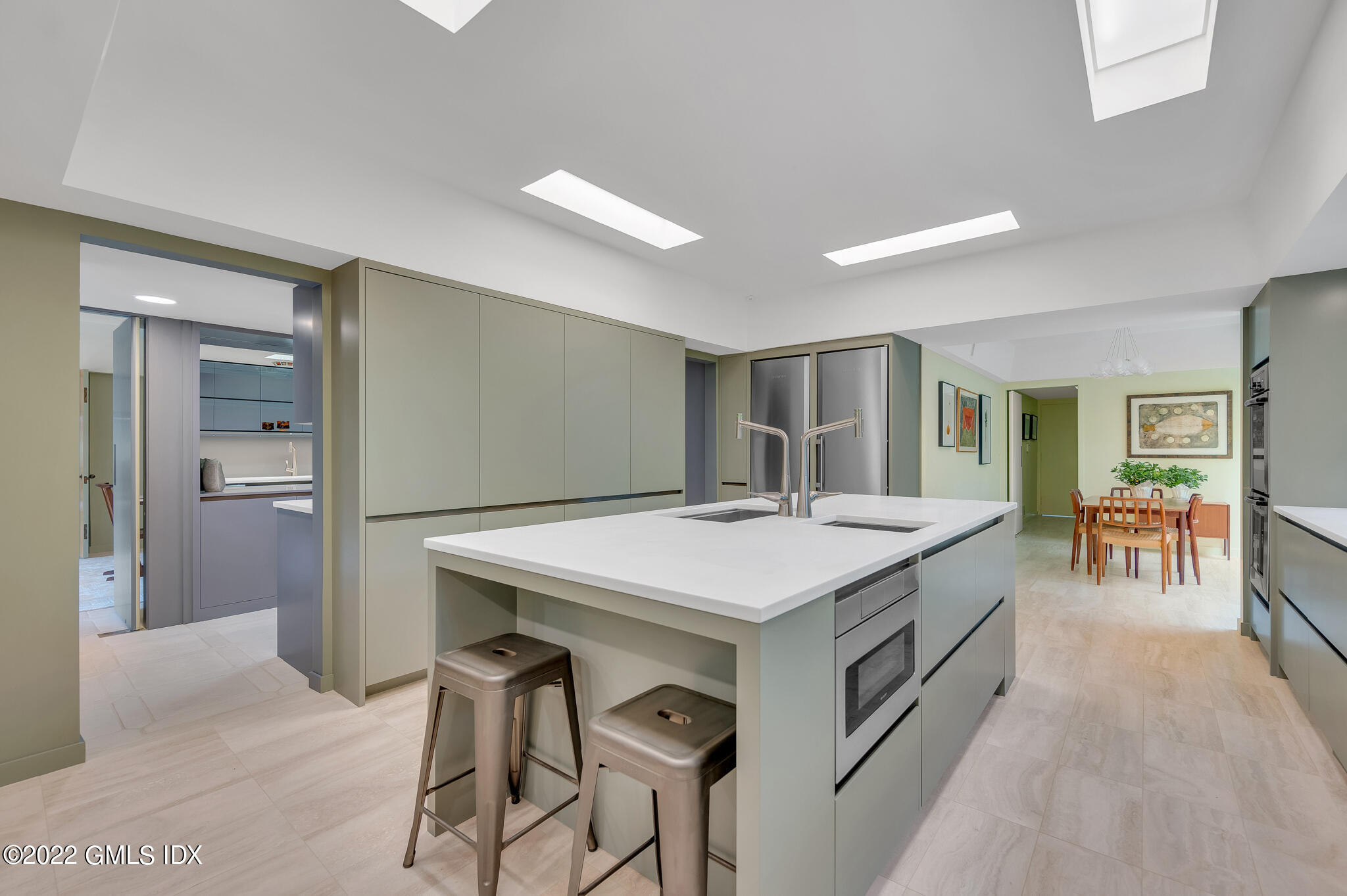 3 North Stanwich Road Greenwich, CT 06831 - Photo 12 of 35 a kitchen with a table and chairs
