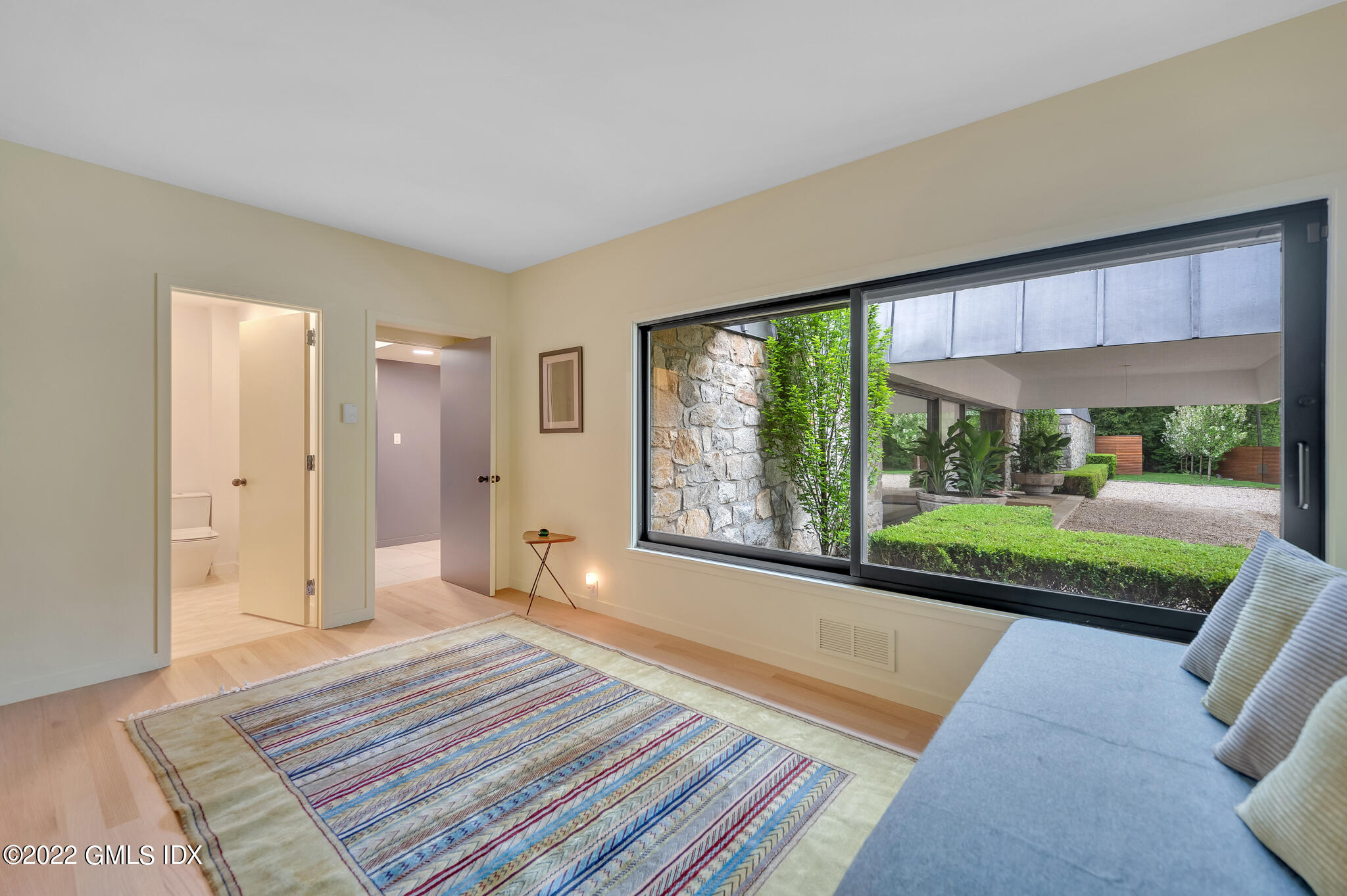 3 North Stanwich Road Greenwich, CT 06831 - Photo 20 of 35 a spacious bedroom with a bed and a large window
