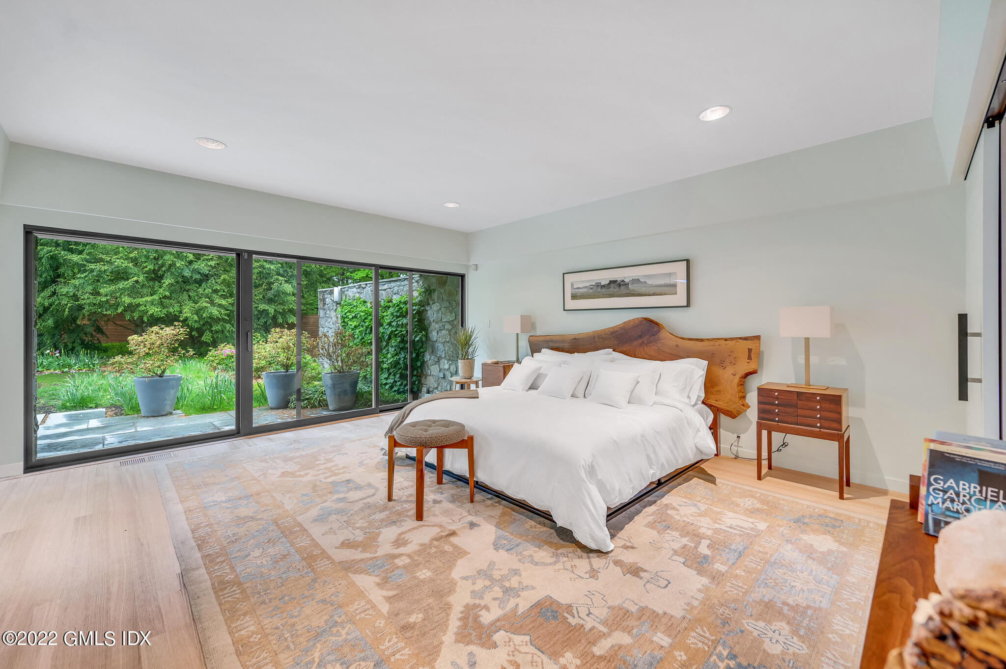 3 North Stanwich Road Greenwich, CT 06831 - Photo 23 of 35 a bedroom with a large bed and a large window