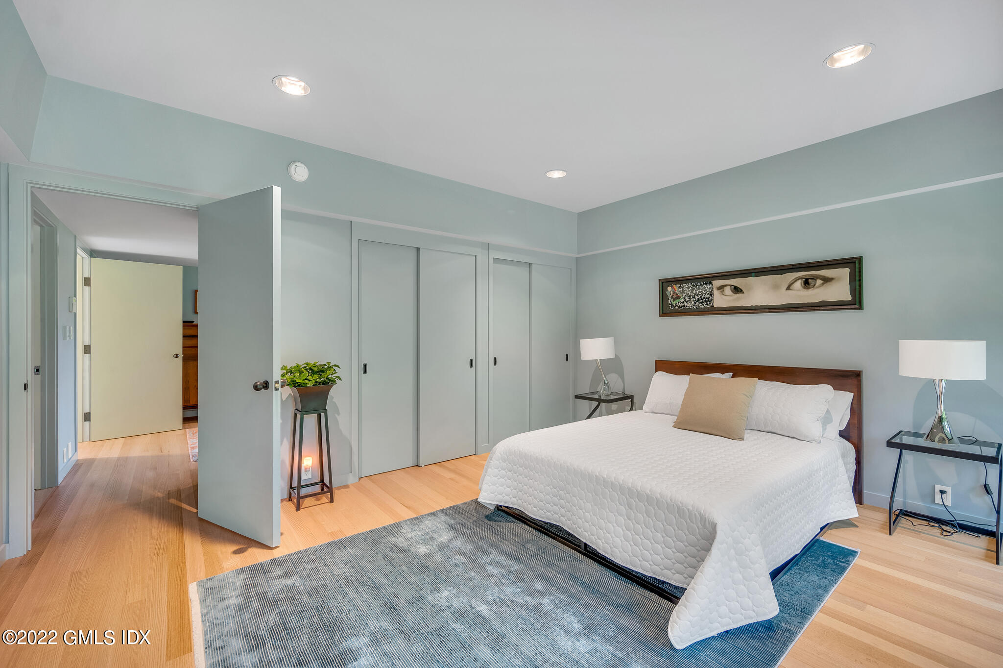 3 North Stanwich Road Greenwich, CT 06831 - Photo 26 of 35 a bedroom with a bed and a table