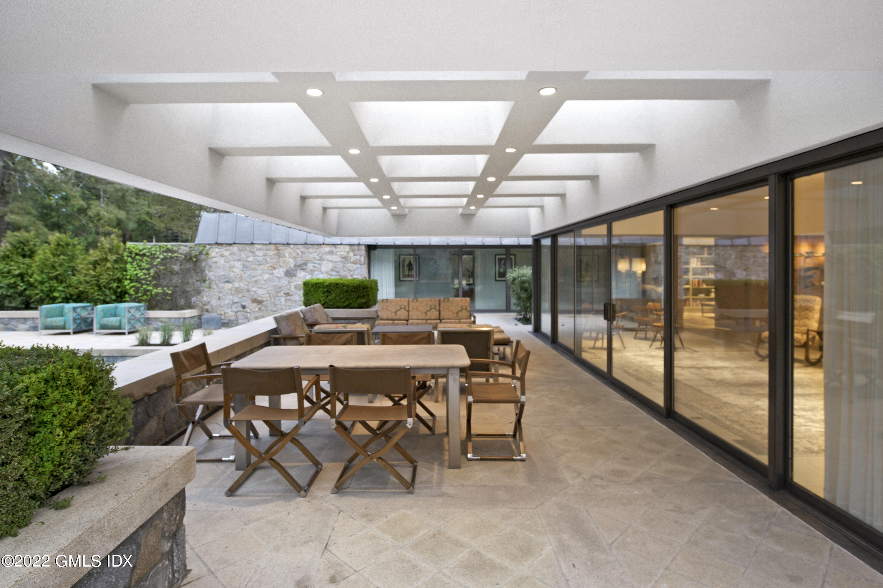3 North Stanwich Road Greenwich, CT 06831 - Photo 29 of 35 a view of a patio with a table and chairs and potted plants