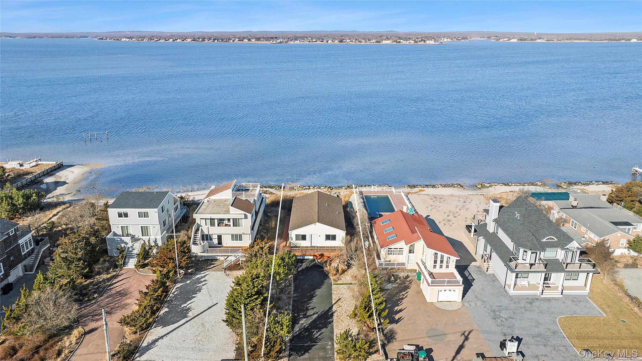626 Dune Road Westhampton Beach, NY 11978 - Photo 1 of 14 an aerial view of a house with a ocean view