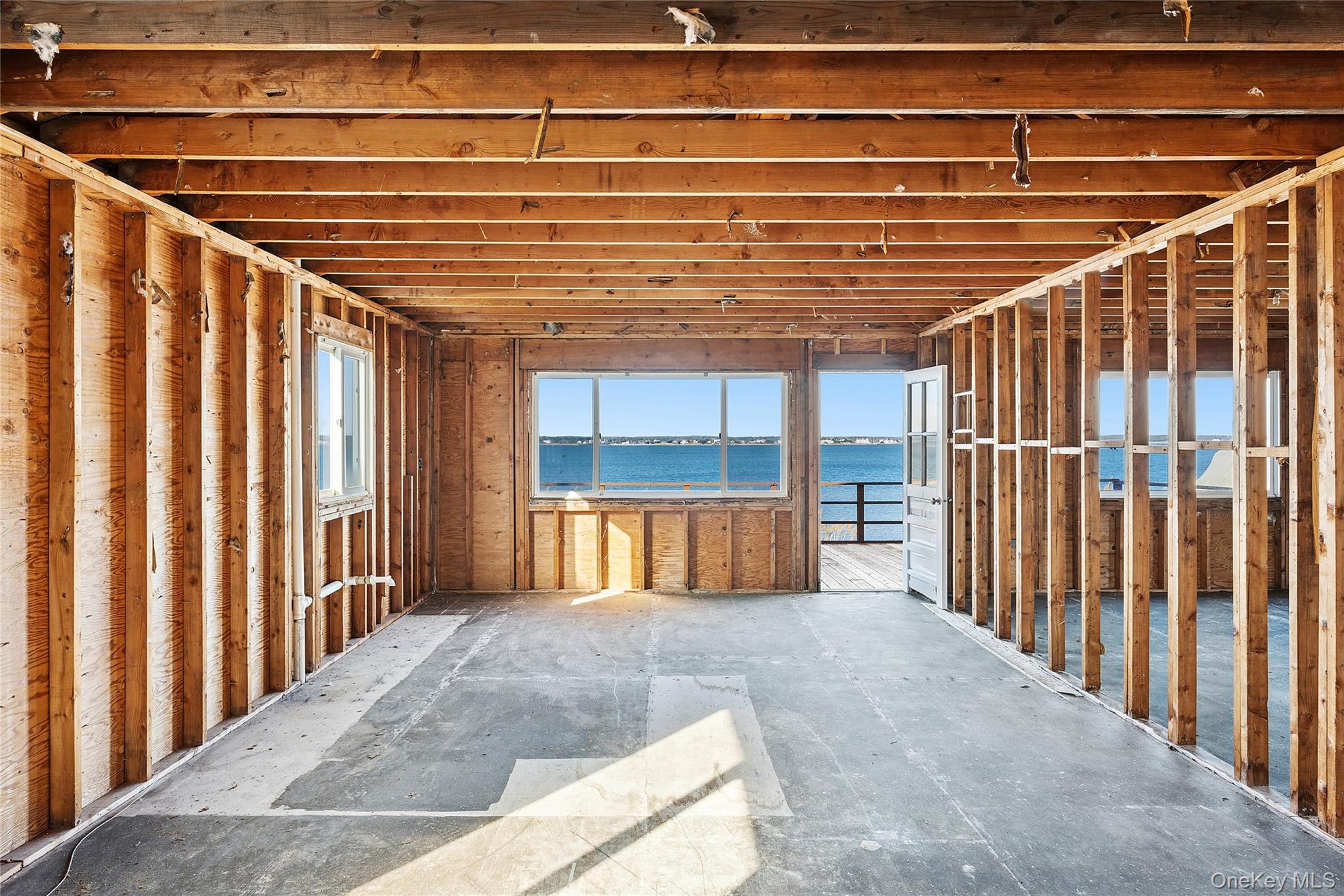 626 Dune Road Westhampton Beach, NY 11978 - Photo 11 of 14 a view of entryway with wooden floor