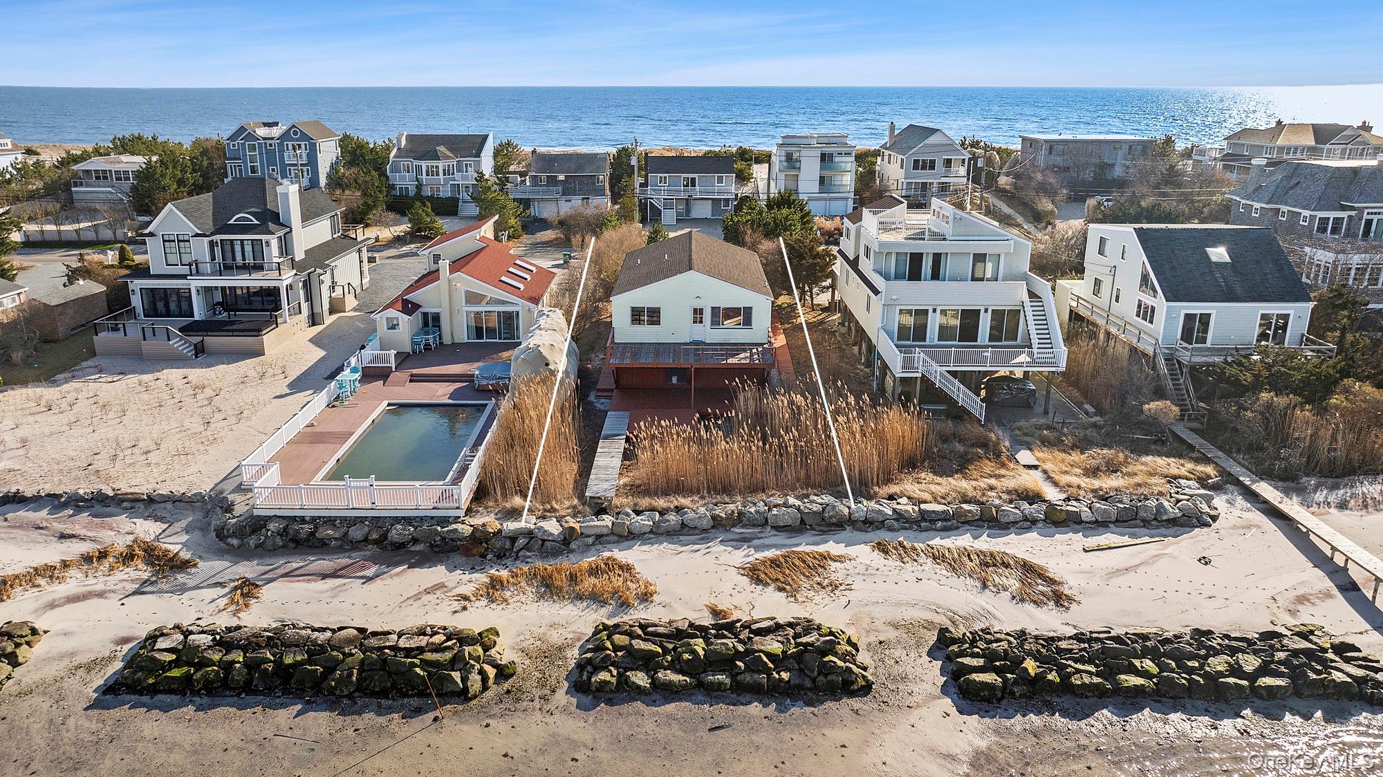 626 Dune Road Westhampton Beach, NY 11978 - Photo 4 of 14 an aerial view of a house with a ocean view