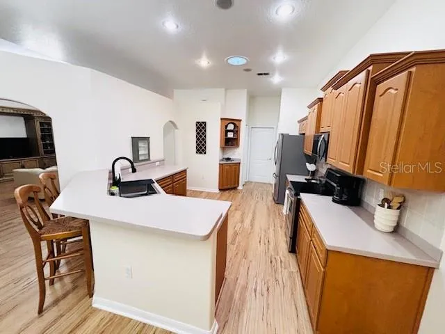 a very nice looking room with kitchen island