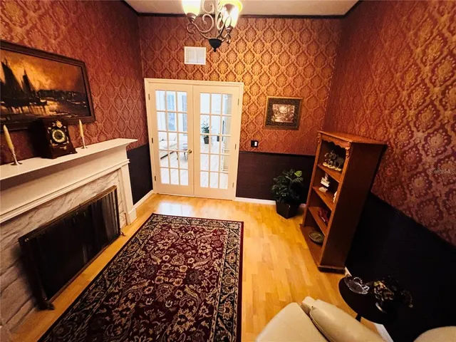 a bed sitting in a room next to a window