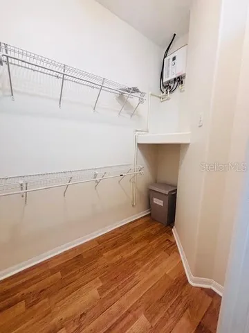 a view of an empty room and a window