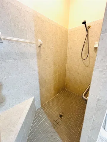 a bathroom with a sink vanity and mirror