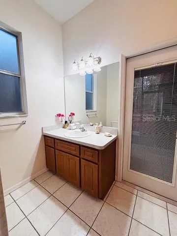 a view of kitchen with furniture and electronic appliances