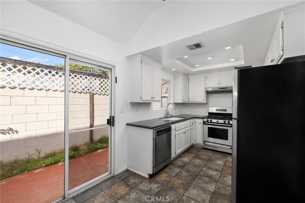 856 West Olive Avenue, Unit C Monrovia, CA 91016 - Photo 15 of 37 a kitchen with granite countertop a refrigerator stove and sink