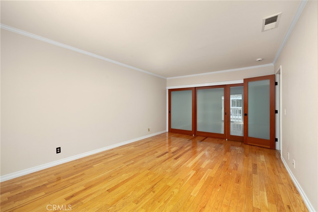 856 West Olive Avenue, Unit C Monrovia, CA 91016 - Photo 24 of 37 a view of an empty room with wooden floor