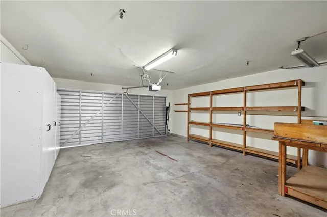 a path view of a house with a garage