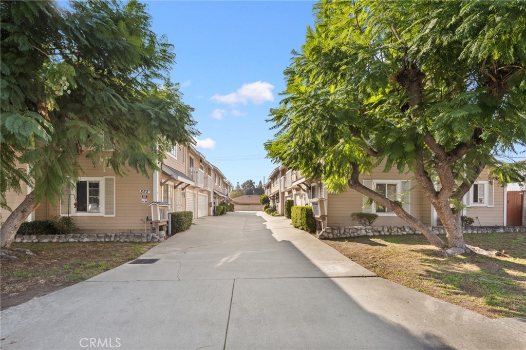 856 West Olive Avenue, Unit C Monrovia, CA 91016 - Photo 4 of 37 a front view of a house with a yard and trees