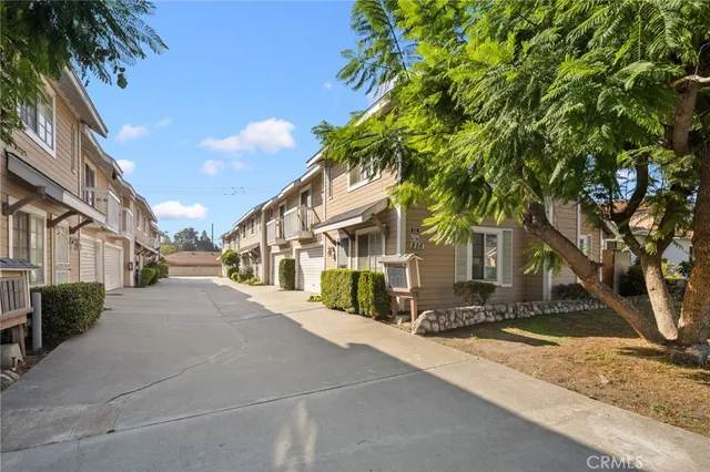 a view of a street with a building in the background