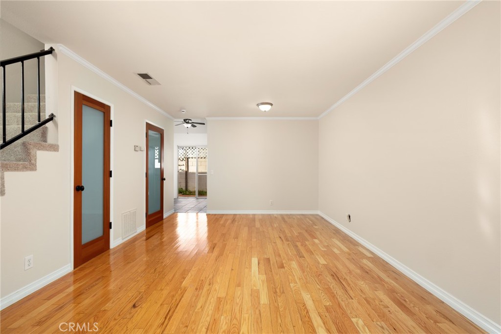 856 West Olive Avenue, Unit C Monrovia, CA 91016 - Photo 8 of 37 a view of a big room with wooden floor and windows
