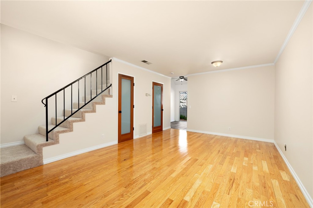 856 West Olive Avenue, Unit C Monrovia, CA 91016 - Photo 9 of 37 a view of an empty room with wooden floor