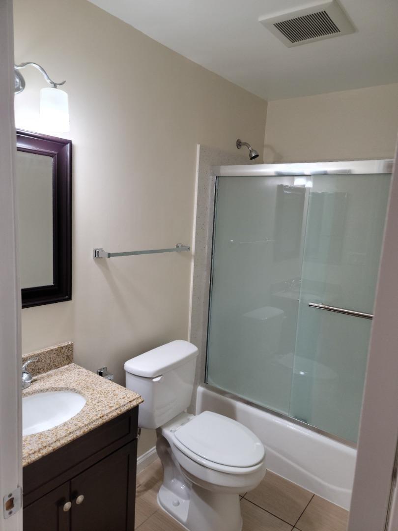 2006 Klamath Avenue, Unit 2 Santa Clara, CA 95051 - Photo 11 of 13 a bathroom with a granite countertop sink toilet and shower