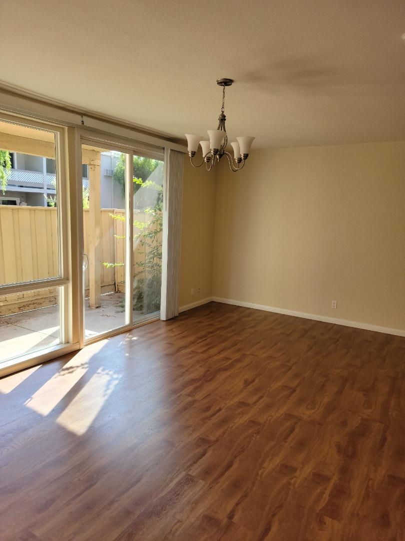2006 Klamath Avenue, Unit 2 Santa Clara, CA 95051 - Photo 5 of 13 an empty room with wooden floor and door
