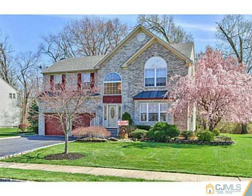 2 Stratton Road Old Bridge, NJ 07747 - Photo 1 of 24 a front view of a house with a garden
