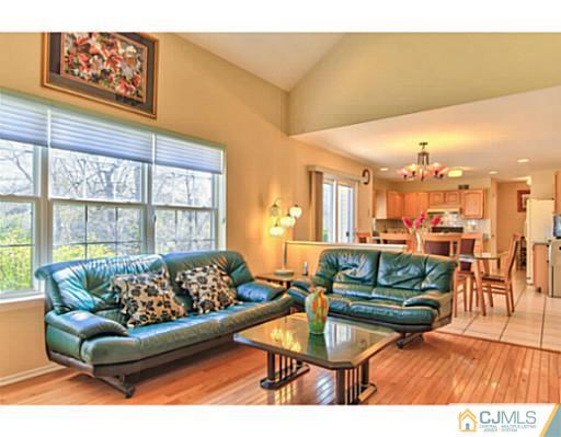 2 Stratton Road Old Bridge, NJ 07747 - Photo 13 of 24 a living room with furniture and a large window