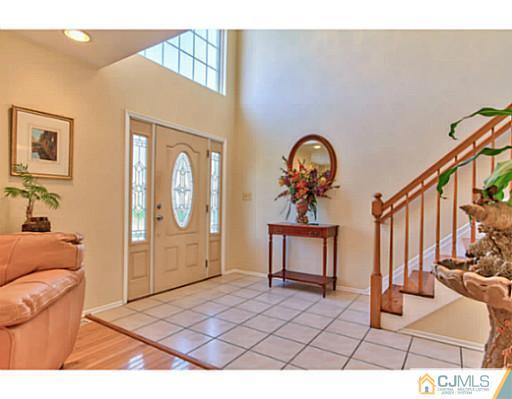 2 Stratton Road Old Bridge, NJ 07747 - Photo 3 of 24 a view of a livingroom with furniture and staircase
