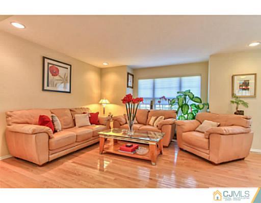 2 Stratton Road Old Bridge, NJ 07747 - Photo 4 of 24 a living room with furniture a rug and a large window