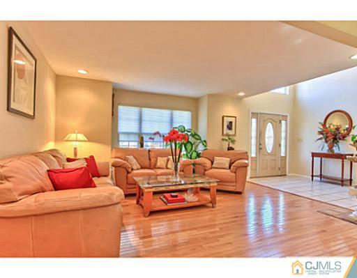 2 Stratton Road Old Bridge, NJ 07747 - Photo 5 of 24 a living room with furniture and wooden floor
