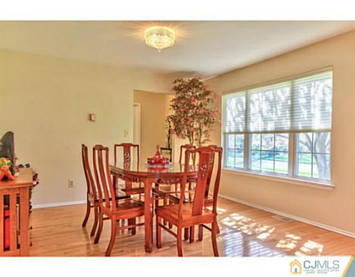 2 Stratton Road Old Bridge, NJ 07747 - Photo 6 of 24 a view of a dining room with furniture and chandelier