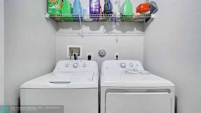 a bedroom with bed and a flat screen tv