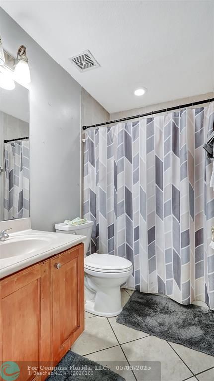 4558 Southwest 125th Lane Miramar, FL 33027 - Photo 21 of 47 a bathroom with a sink toilet and shower