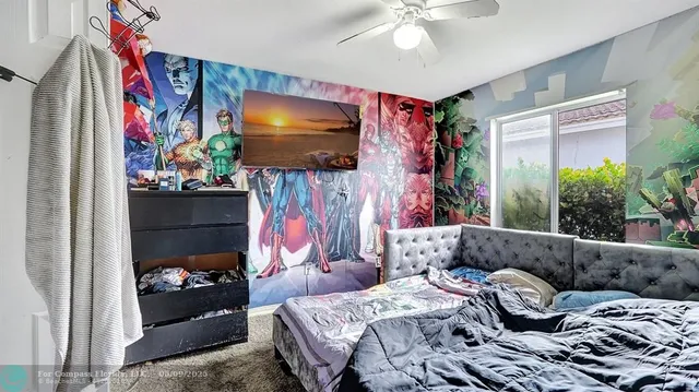 a bedroom with furniture and a window