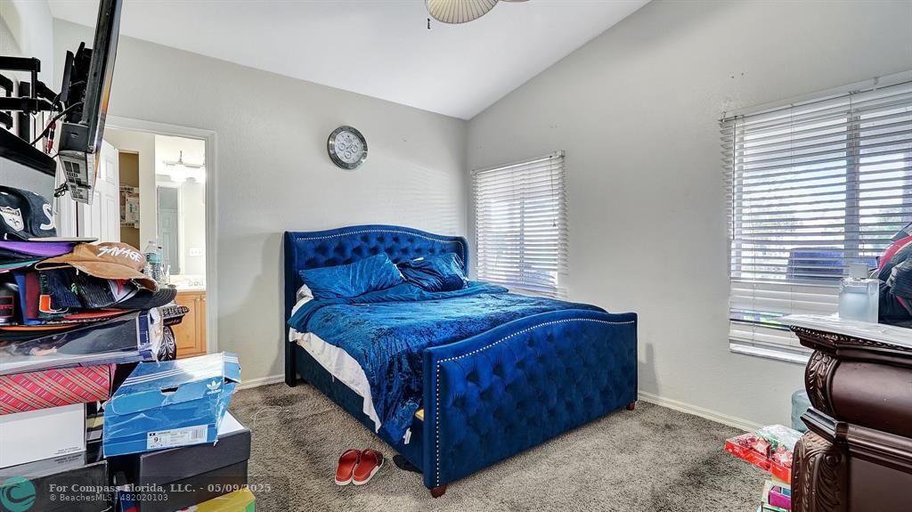 4558 Southwest 125th Lane Miramar, FL 33027 - Photo 23 of 47 a bedroom with furniture and a window