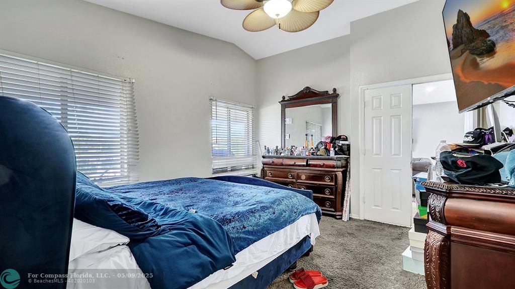 4558 Southwest 125th Lane Miramar, FL 33027 - Photo 24 of 47 a bedroom with a bed and flat screen tv