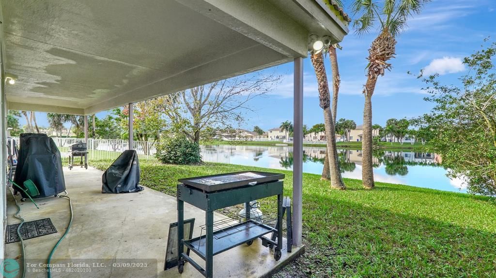 4558 Southwest 125th Lane Miramar, FL 33027 - Photo 28 of 47 a view of a patio with chairs and a yard