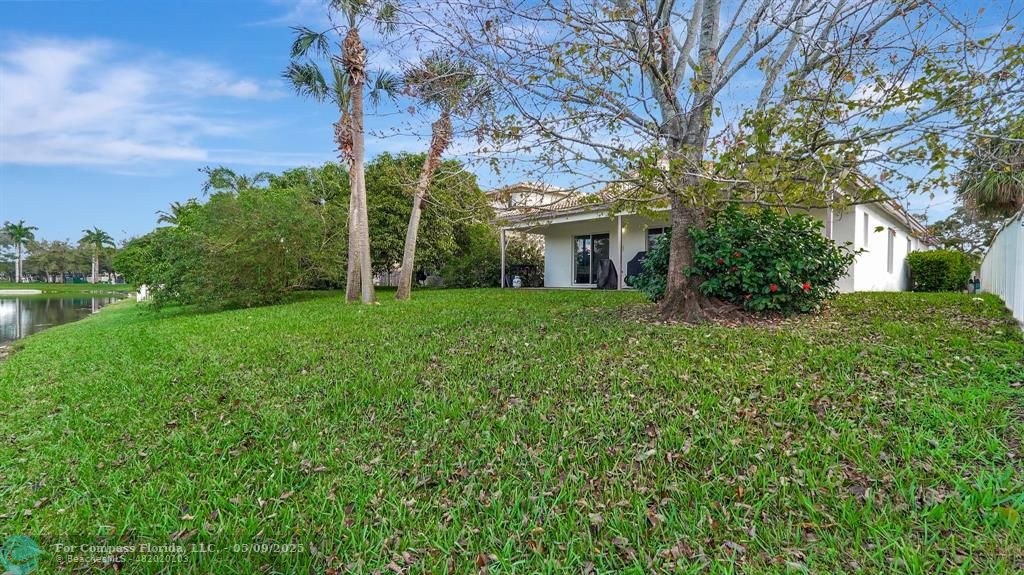 4558 Southwest 125th Lane Miramar, FL 33027 - Photo 30 of 47 a view of a house with a big yard and large tree