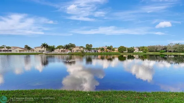 a view of a lake with a garden