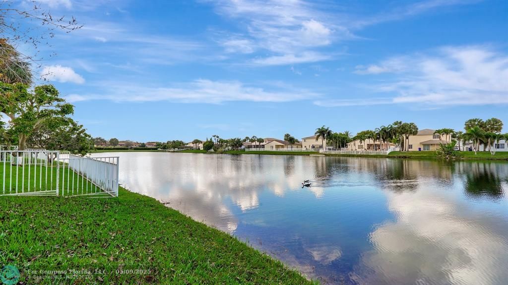 4558 Southwest 125th Lane Miramar, FL 33027 - Photo 35 of 47 a view of a lake with a garden