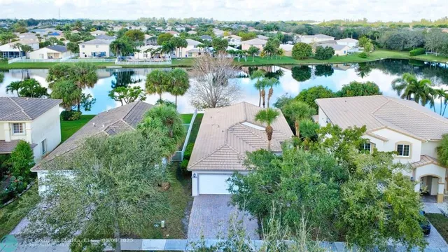 an aerial view of a house with a lake view