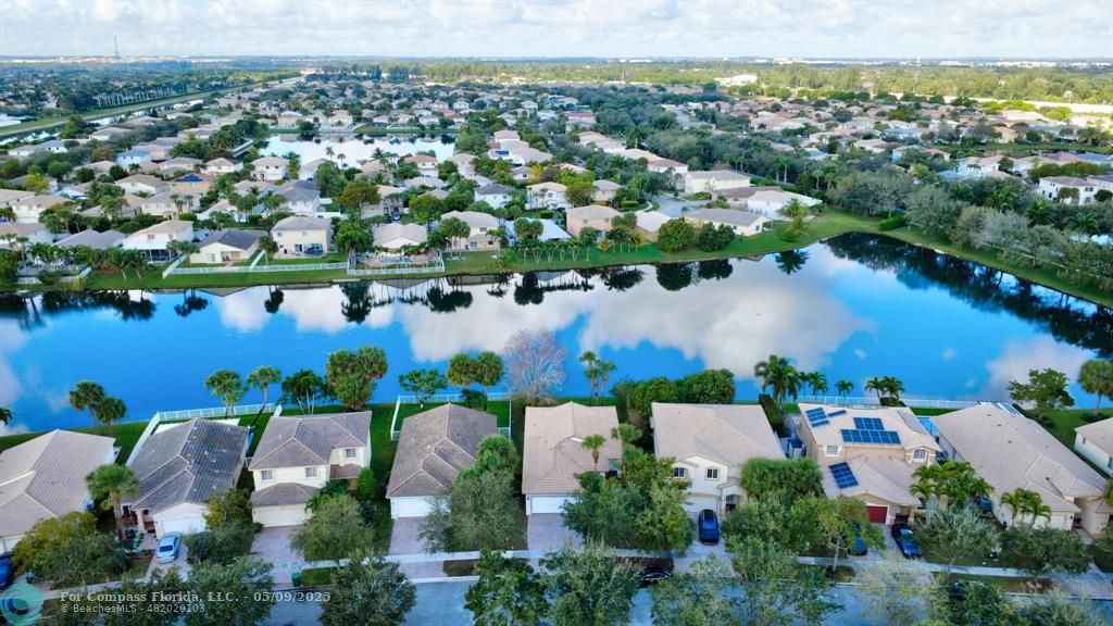 4558 Southwest 125th Lane Miramar, FL 33027 - Photo 39 of 47 an aerial view of a house with a lake view