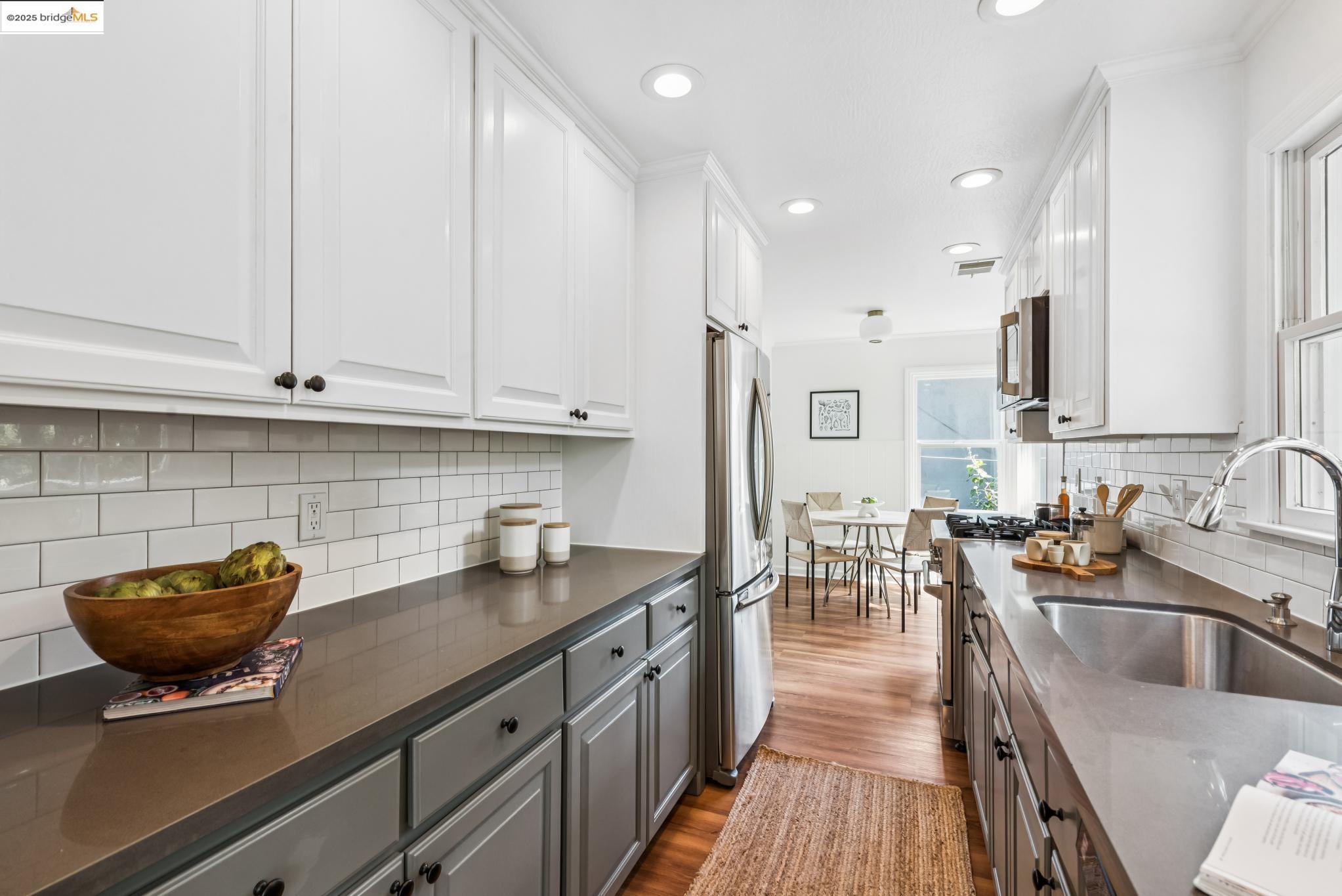 4479 Elinora Avenue Oakland, CA 94619 - Photo 14 of 47 Kitchen featuring gray cabinetry, tasteful backsplash, white cabinetry, dark wood finished floors, and recessed lighting