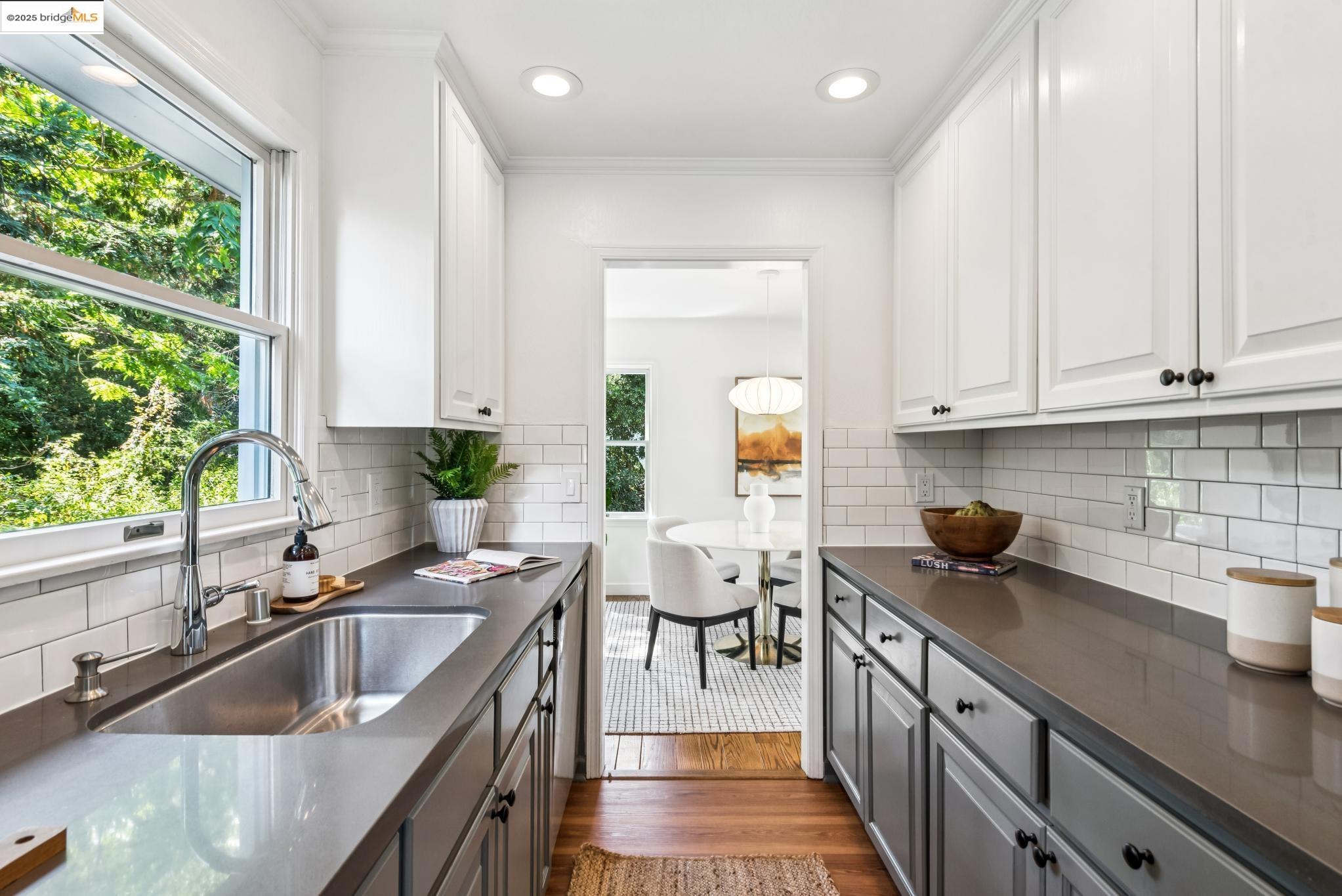 4479 Elinora Avenue Oakland, CA 94619 - Photo 15 of 47 Kitchen featuring dark wood-style floors, white cabinets, decorative light fixtures, recessed lighting, and gray cabinetry