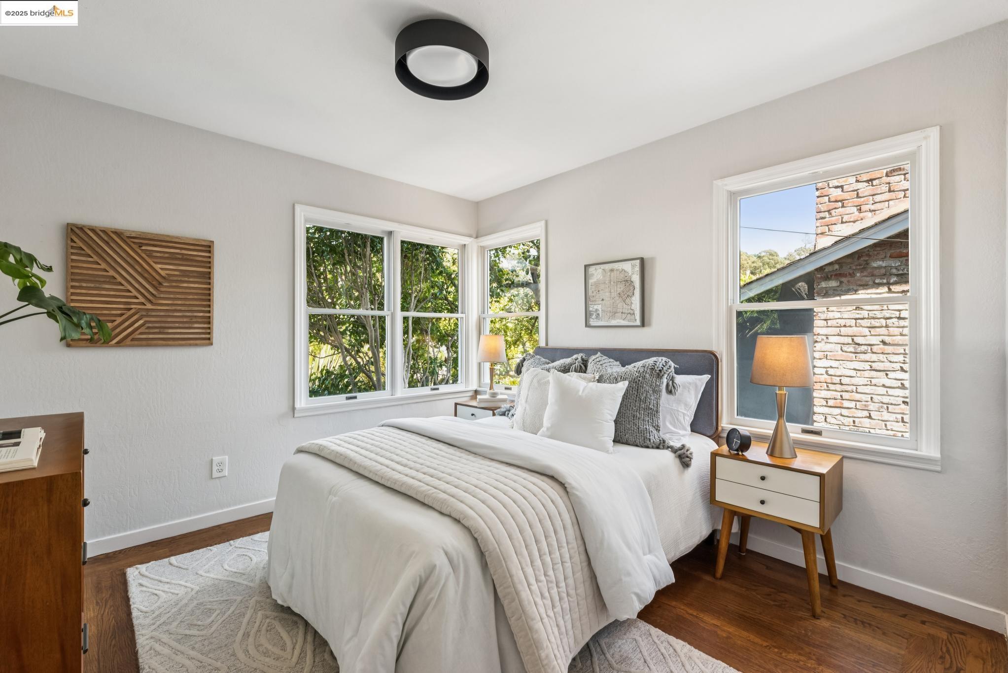 4479 Elinora Avenue Oakland, CA 94619 - Photo 18 of 47 Bedroom featuring baseboards and dark wood-style flooring
