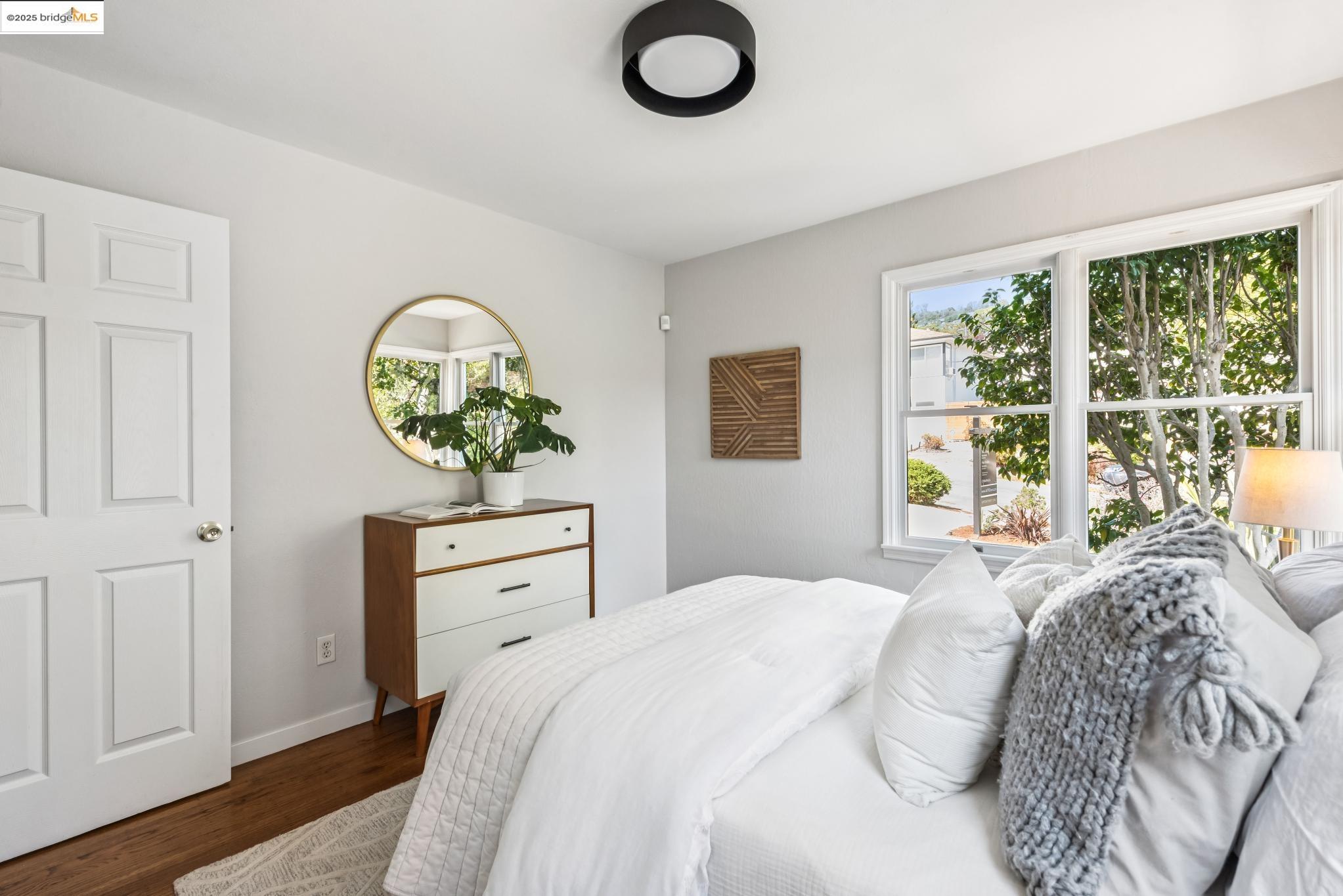4479 Elinora Avenue Oakland, CA 94619 - Photo 19 of 47 Bedroom with dark wood-type flooring and baseboards