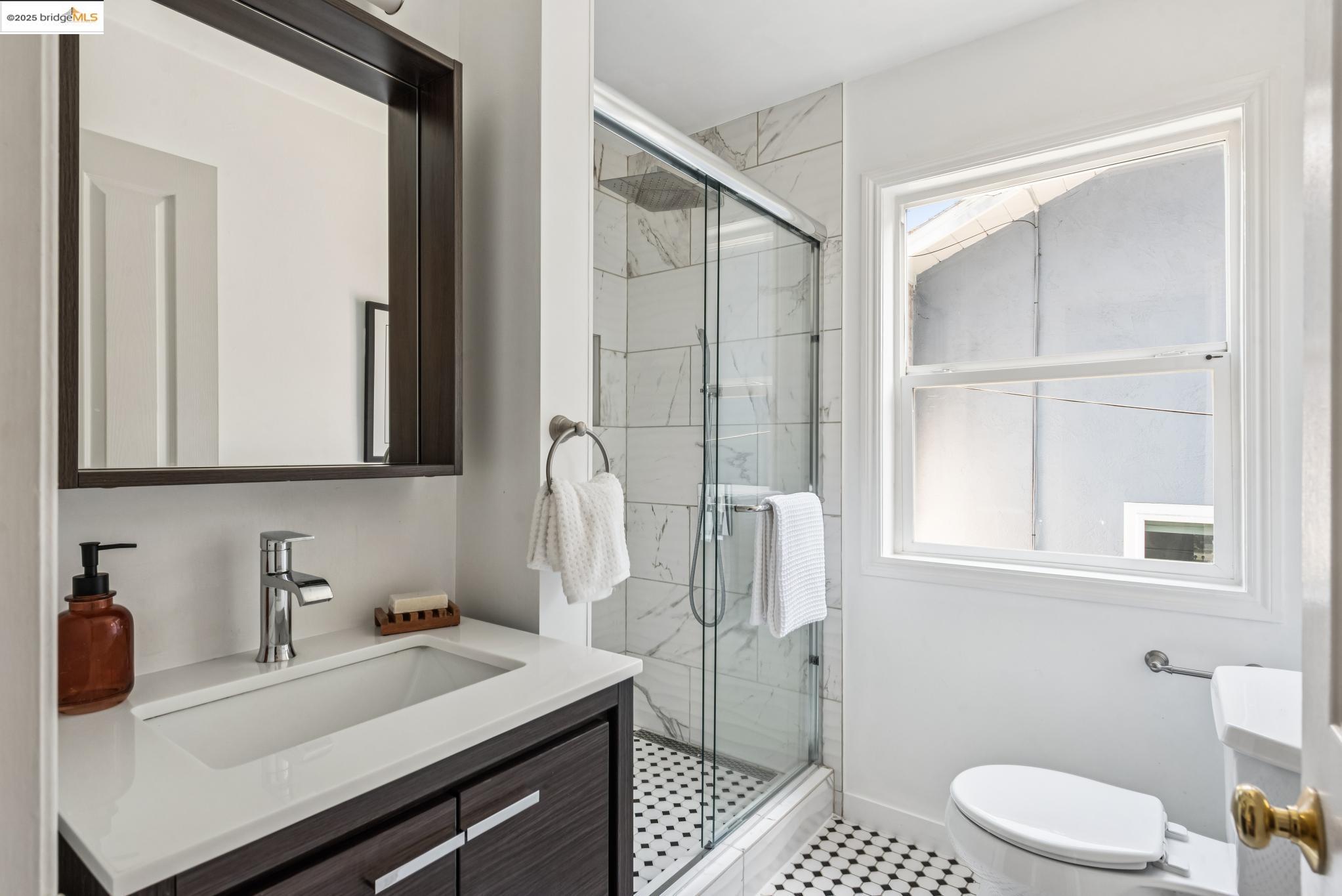 4479 Elinora Avenue Oakland, CA 94619 - Photo 20 of 47 Full bath with a marble finish shower and vanity