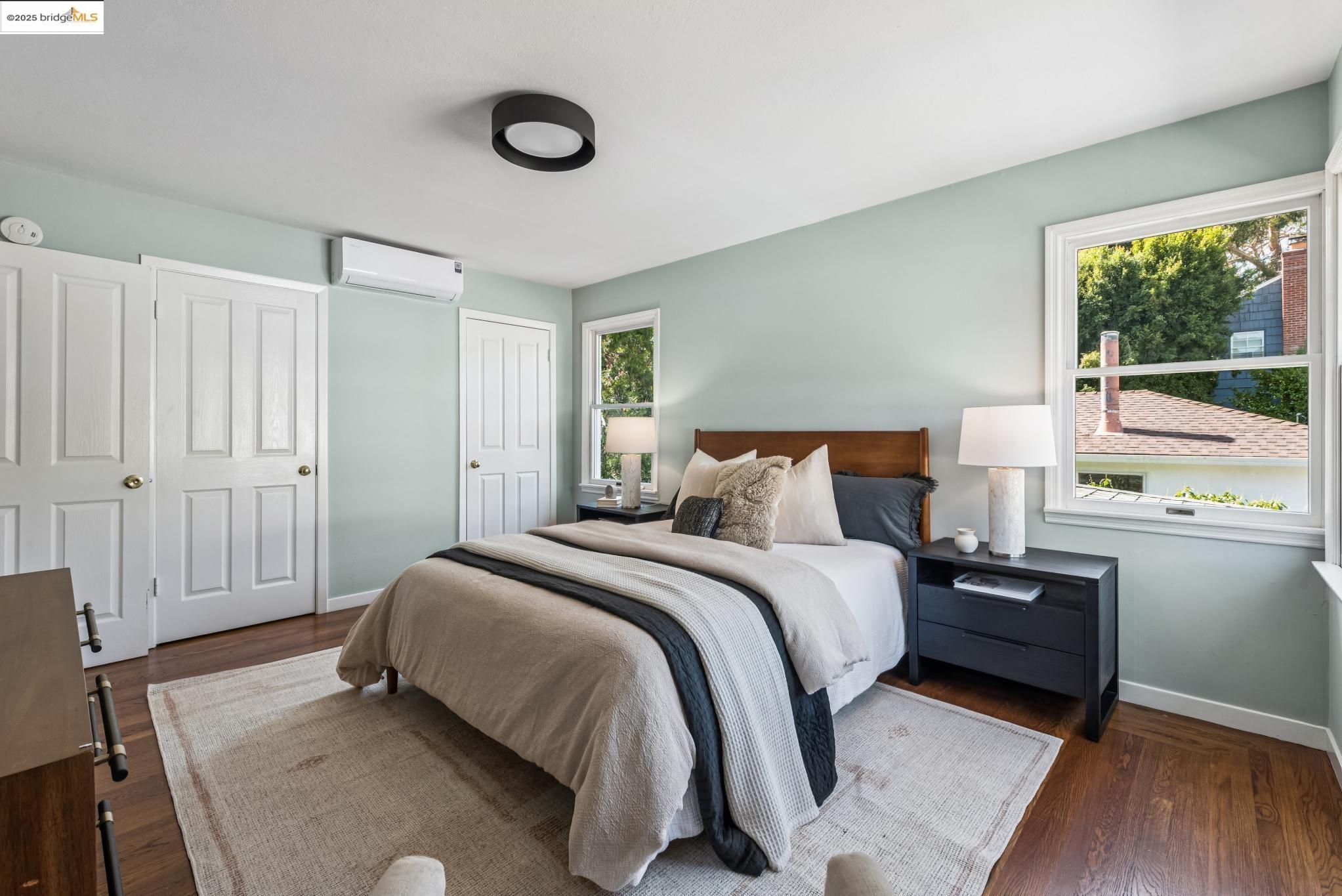 4479 Elinora Avenue Oakland, CA 94619 - Photo 22 of 47 Bedroom with dark wood-type flooring and an AC wall unit