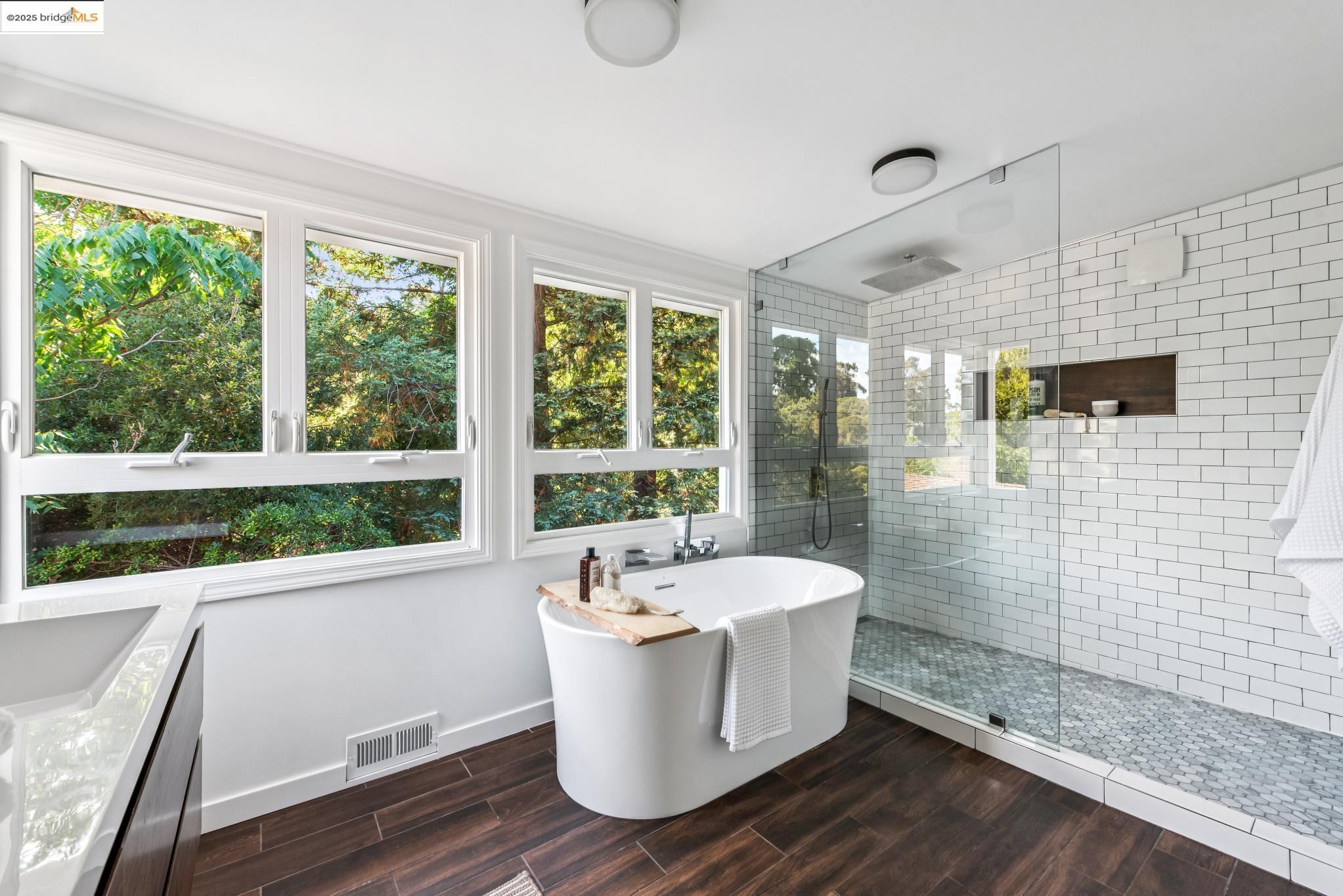 4479 Elinora Avenue Oakland, CA 94619 - Photo 24 of 47 Full bath featuring a freestanding bath, a walk in shower, vanity, and wood tiled floors