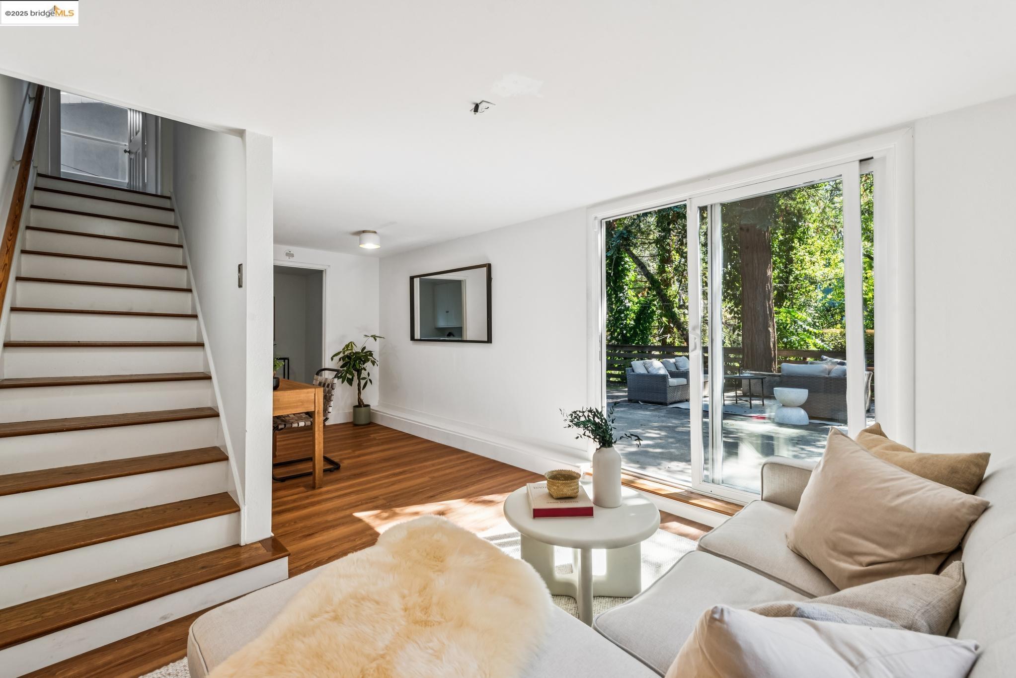 4479 Elinora Avenue Oakland, CA 94619 - Photo 30 of 47 Living room with stairs and wood finished floors