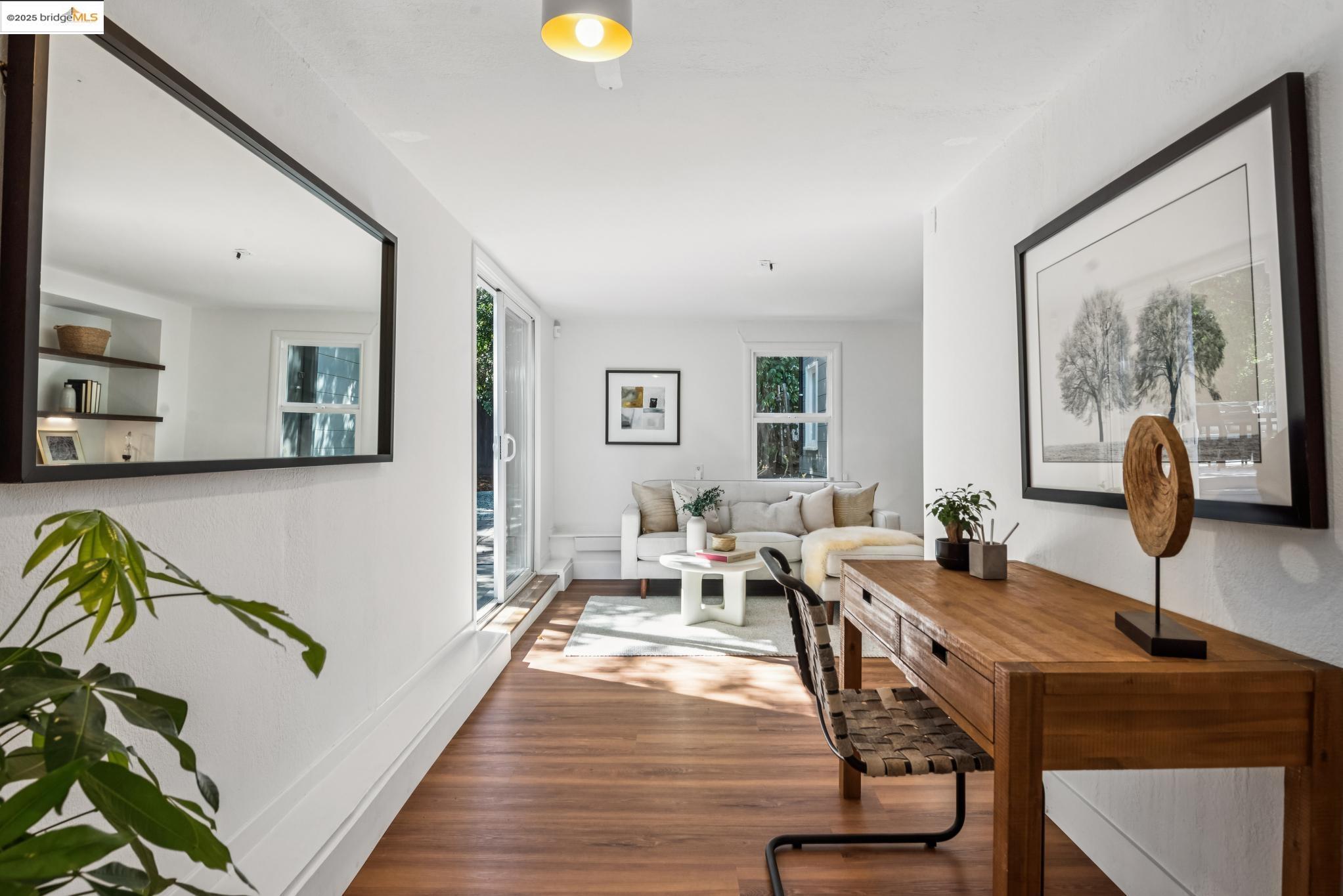 4479 Elinora Avenue Oakland, CA 94619 - Photo 32 of 47 Living room featuring wood finished floors and baseboards